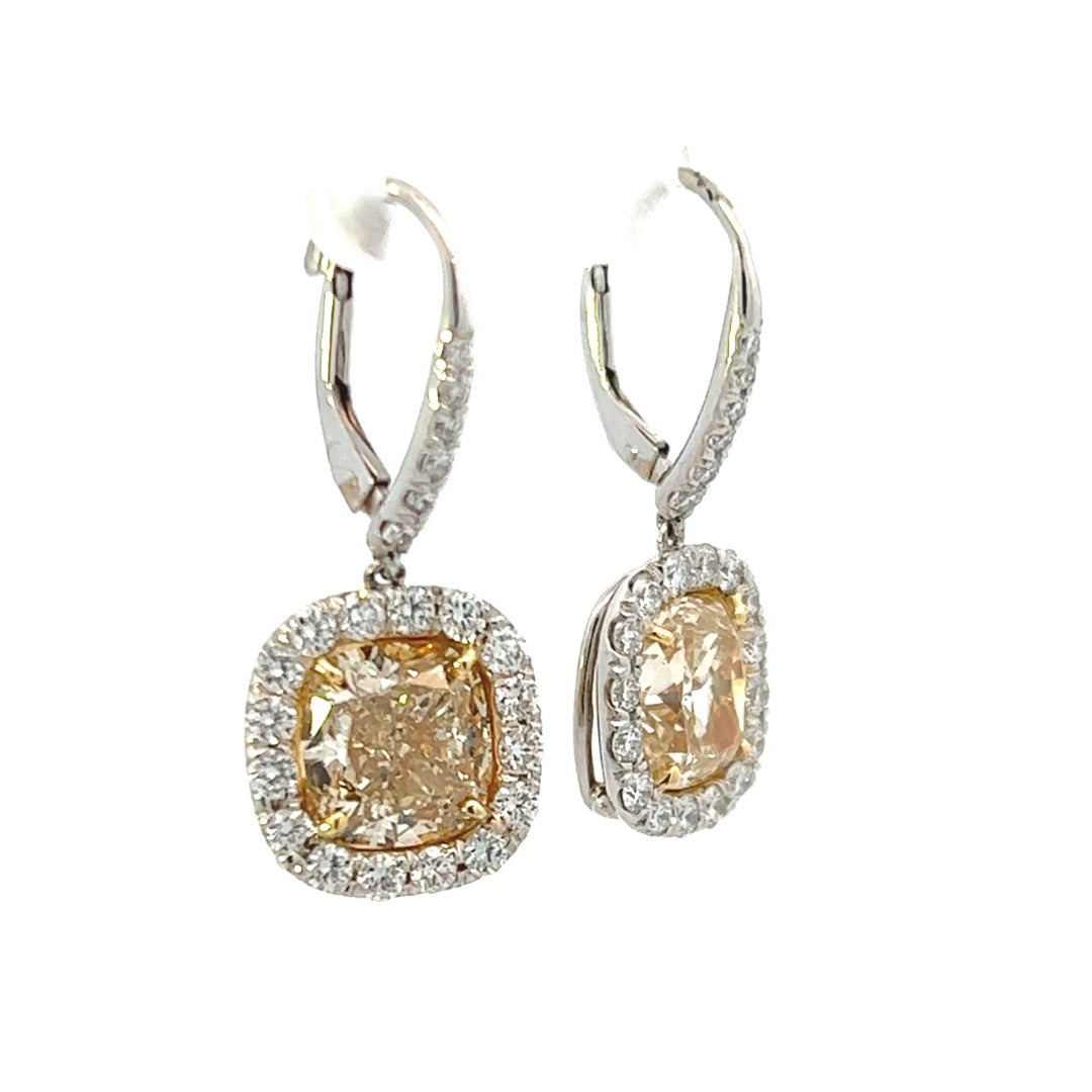 Platinum and 18K Yellow Gold Cushion Cut Fancy Yellow Diamond Halo Drop Earrings (7.25ctw) 